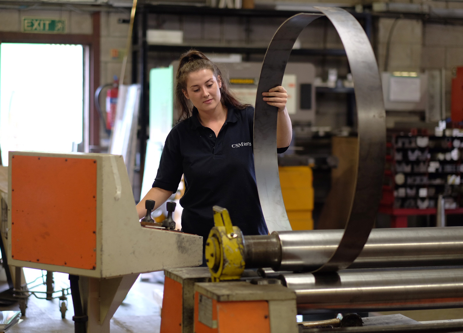CSM team member bending metal